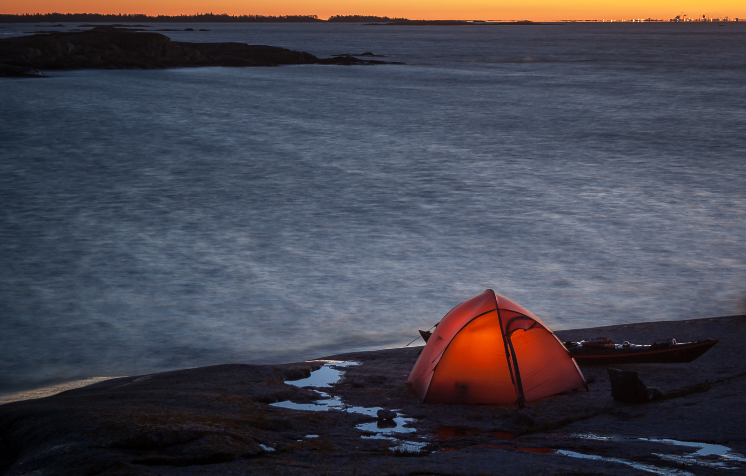 A sea kayakers tent pitched close to the sea in Sörmland archipelago, Sweden