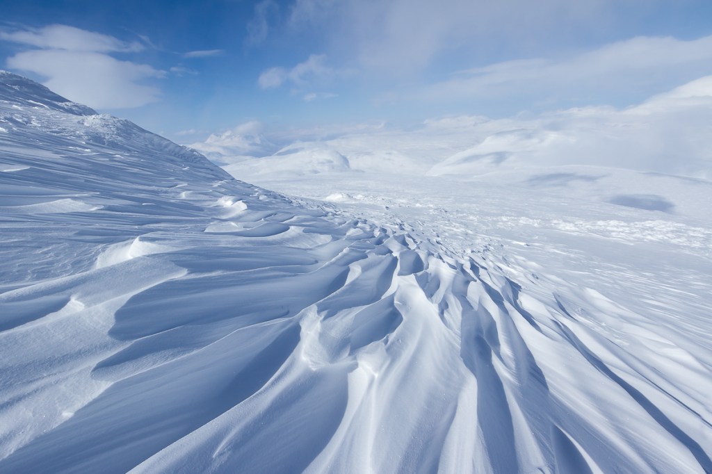 Beautiful wind patterns in the snow on mount Vassitjåkka, Swedish Lapland